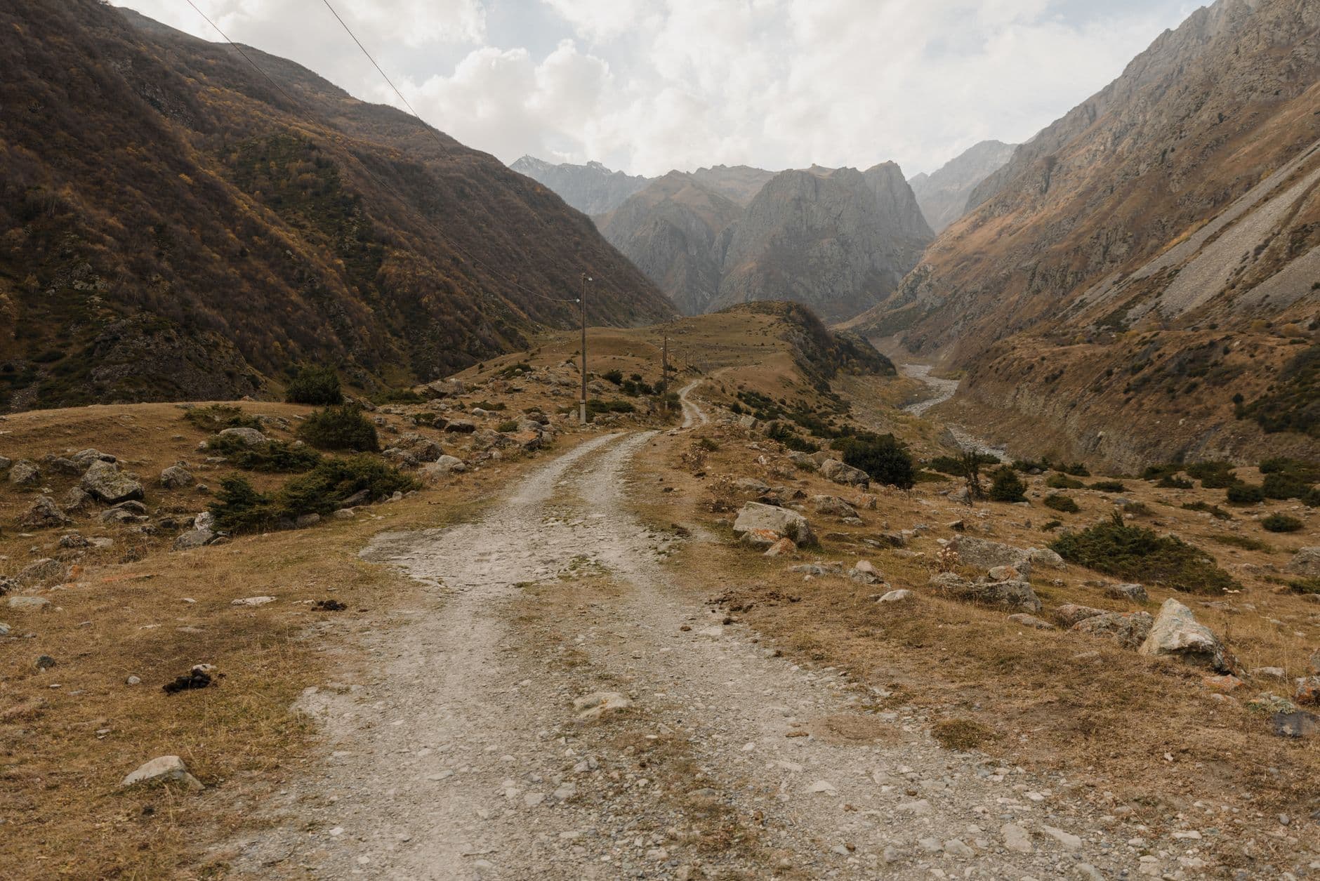 Truso Valley trail in the Caucasus mountains with a picturesque panoramic view during summer.
